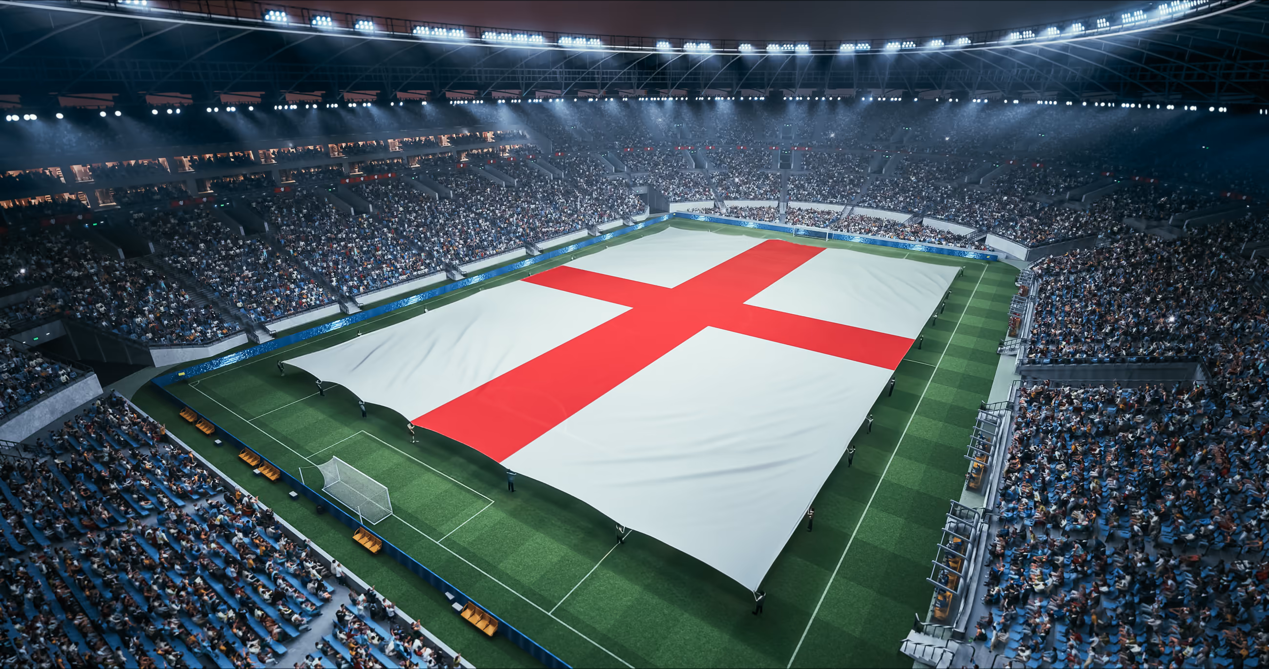 An England flag unfurled across a floodlit football stadium